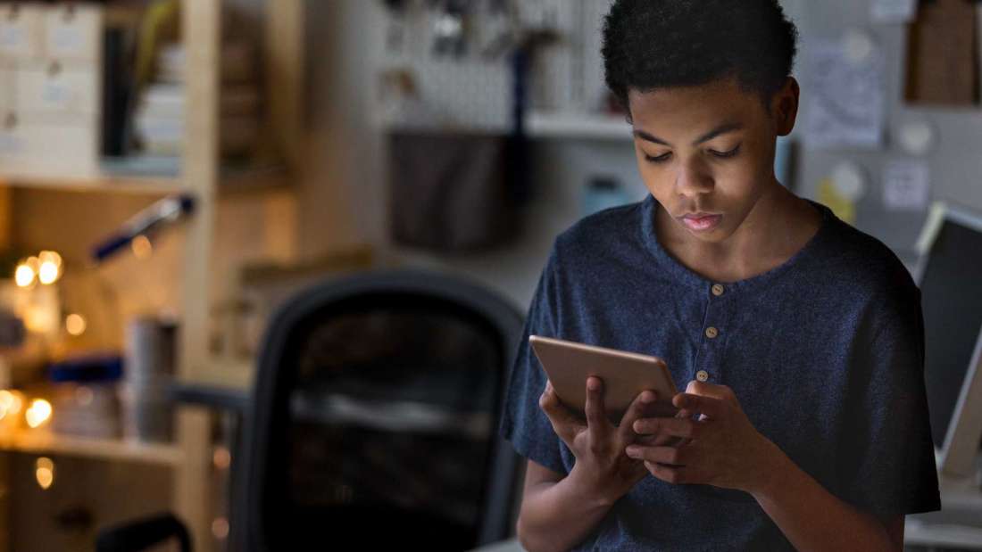 teen-boy-being-cyberbullied-on-tablet